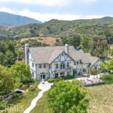 White two story house on large acre.