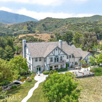 White two story house on large acre.